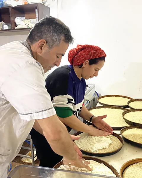 Gonca Tokyol Engin Dinç and his wife, Lamia, make künefe in Hatay after the earthquakes (Credit: Gonca Tokyol)