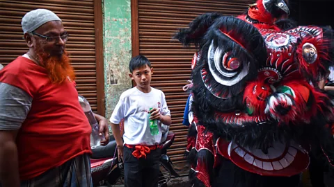 Sudipta Das/Alamy Chinese culture can still be seen in the annual lion dances to welcome the Lunar New Year (Credit: Sudipta Das/Alamy)