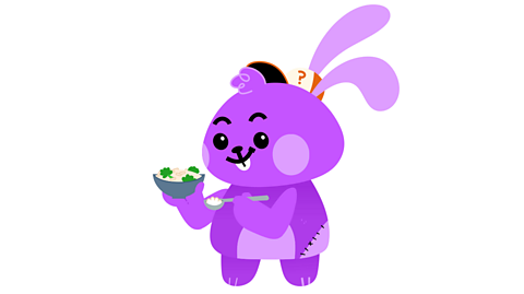 Bunny eating a rice dish from a bowl