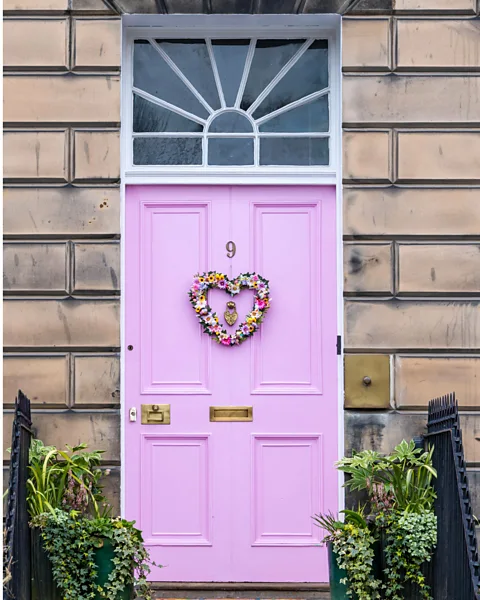 Alamy Miranda Dickson painted the front door of her Edinburgh house pink but was told by the authorities this was unacceptable (Credit: Alamy)