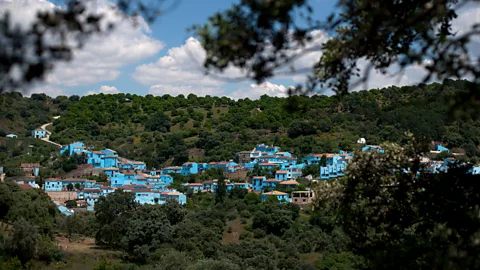 Getty Images Controversially, the village of Júzcar in Spain was painted blue to promote a Smurfs movie (Credit: Getty Images)