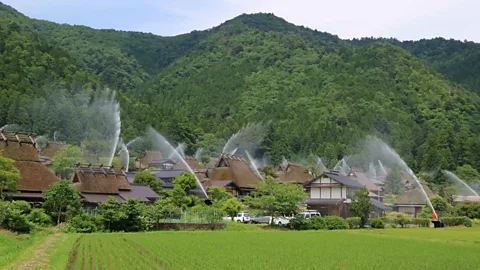 Kyoto Miyama Tourism Association Kayabuki no Sato's fire suppression system is tested twice a year during the Water Hose Festival (Credit: Kyoto Miyama Tourism Association)