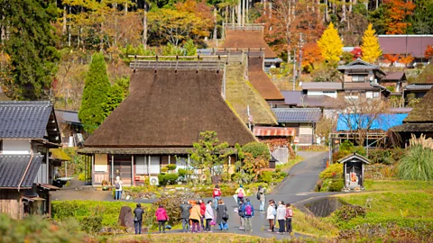 Kyoto Miyama Tourism Association Visitors to Miyama can experience life in these rural villages and learn skills like thatching (Credit: Kyoto Miyama Tourism Association)