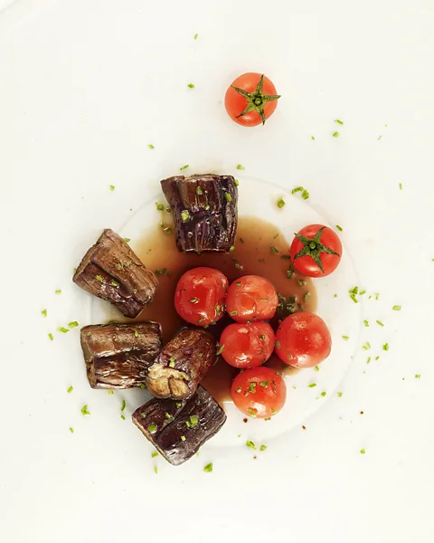 Wookwan Sunim Wookwan Sunim braised eggplant with cherry tomatoes (Credit: Wookwan Sunim)