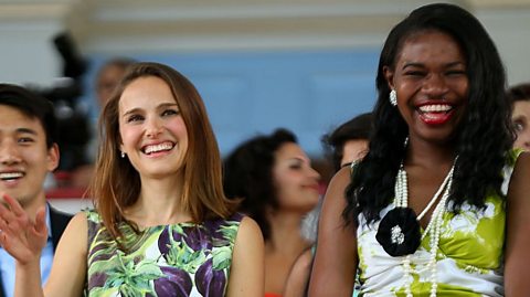 Actress Natalie Portman (left), smiling and waving. 