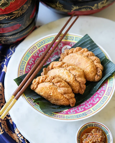 Mogan Anthony Seleste Tan and Mogan Anthony's curry puff at Lady Wong (Credit: Mogan Anthony)