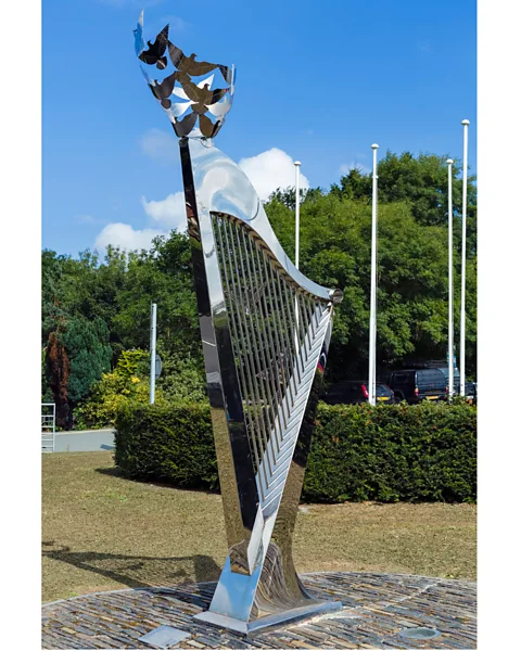 Alamy A harp sculpture stands outside the International Musical Eisteddfod site in Llangollen, Wales (Credit: Alamy)