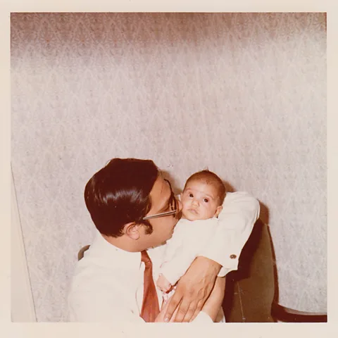 Mithu Sanyal Mithu Sanyal as a baby, with her father (Credit: Mithu Sanyal)