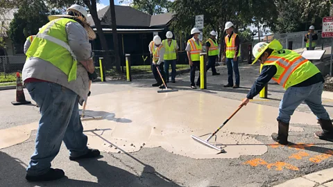 City of San Antonio A pavement is painted white to reflect the heat in San Antonio in April 2023 (Credit: City of San Antonio)