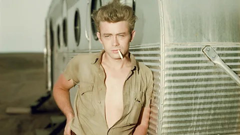 Getty Images Actor James Dean learning against a trailer on the set of the film Giant (Credit: Getty Images)