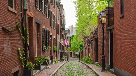 Zachary Frank/Alamy Image of homes along a Boston alleyway