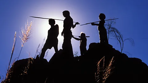 Penny Tweedie/Alamy Aboriginal elder and three young men hunting with spears