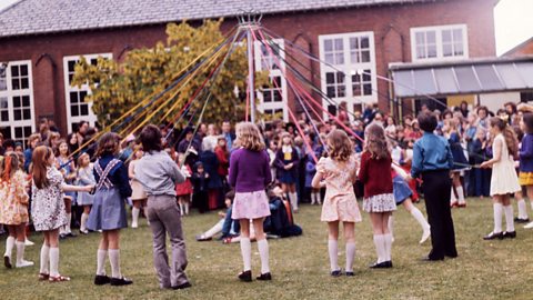 Children get ready to dance around a Maypole in the 1970s