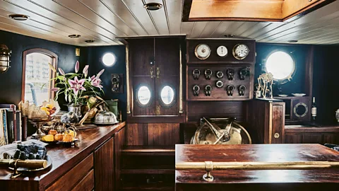 Roger Bool The interior of De Walvisch has been renovated with reclaimed wood – the sailing clipper is moored in East London (Credit: Roger Bool)