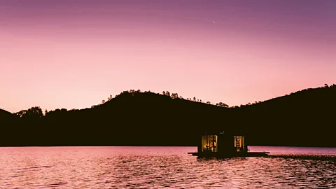 Mel Audi Floor-to-ceiling windows create great views across the water on the off-grid Altar, Brazil (Credit: Mel Audi)