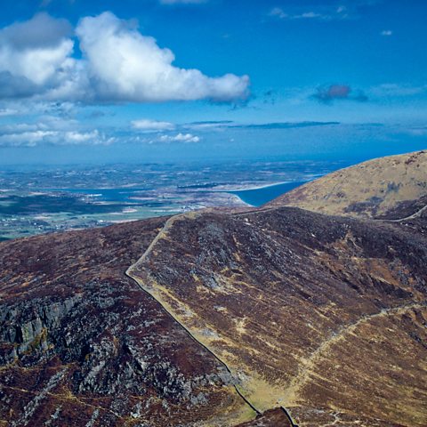 Photograph showing the Mourne Wall in the Mourne mountains on a sunny day. 