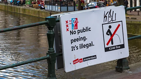 Carolyn Jenkins/Alamy Signs throughout Amsterdam warn visitors not to urinate in public. (Photo by Carolyn Jenkins/Alamy)