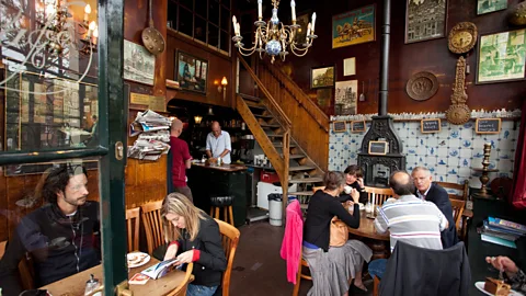 frans lemmens/Alamy Amsterdam's legendary Brown Bar resembles an old-fashioned neighborhood dive bar (Credit: frans lemmens/Alamy)