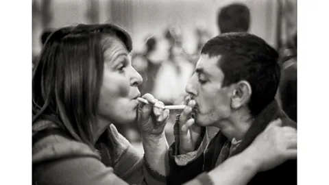 Lia Pasqualino Letizia Battaglia with a patient at a psychiatric hospital in Palermo in 1986 (Credit: Lia Pasqualino)