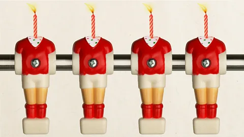 Getty Images Illustration of four birthday candles as table football players (Credit: Getty Images)