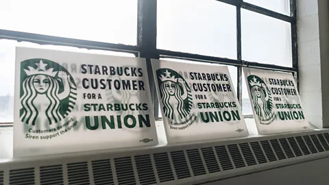 Getty Images Signs of customer support at the Starbucks Workers United hub in Buffalo, New York, during the unionisation effort in 2021 (Credit: Getty Images)