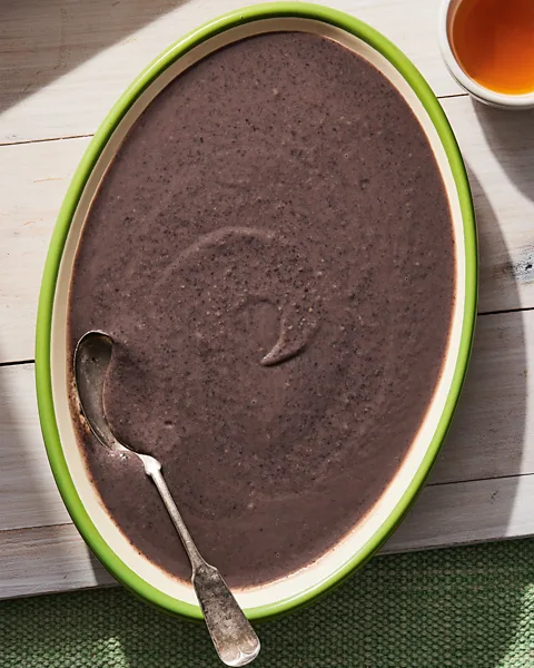 World Central Kitchen Cookbook/Clarkson Potter Sòs Pwa Nwa (Black Bean Sauce) from the World Central Kitchen Cookbook (Credit: World Central Kitchen Cookbook/Clarkson Potter)