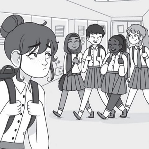 A group of girls in a school corridor are smiling and laughing, one girl is all alone feeling sad.