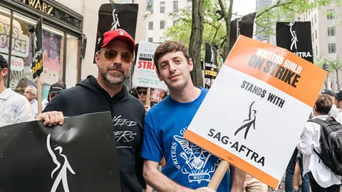 Alamy High profile celebrities, including Ted Lasso's Jason Sudekis, walked the picket line with WGA and SAG-AFTRA members this summer (Credit: Alamy)