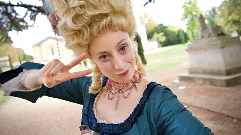 Marie Antoinette giving a peace sign.