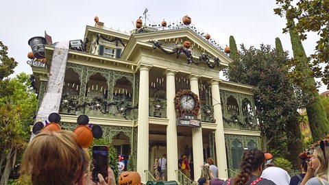 Disney's Haunted Mansion, a 19th Century New Orleans-style house decked in halloween decorations.