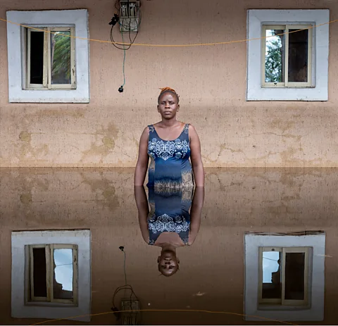 Gideon Mendel Joy Christian, Dorca Executive Apartments Otuoke, Ogbia Municipality Bayelsa State, Nigeria, November 2022, from the series Drowning World (Credit: Gideon Mendel)