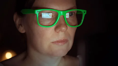 Woman with green glasses