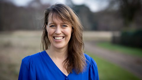 Co-founder and chief operating officer Francis Zoet is smiling. She is wearing a blue blouse and is stood outside with grass, a path and a tree in the distance.