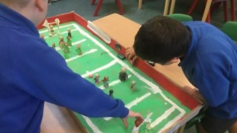 Two pupils playing a rugby-based micro:bit activity