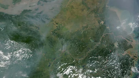 Getty Images The brown haze that pollutes some regions of Asia can be seen from satellites; could alien socieites leave similar signs?  (Credit: Getty Images)