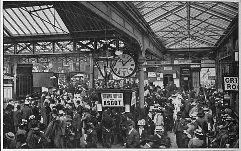Horse racing fans at Waterloo Station in London waiting for trains to go to the races at Ascot race course, around 1900. 