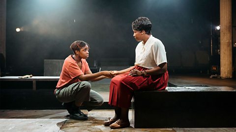 Two actors on stage in Leave Taking.