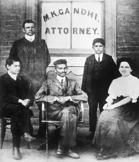 Gandhi and his associates pose in front of his law offices in South Africa