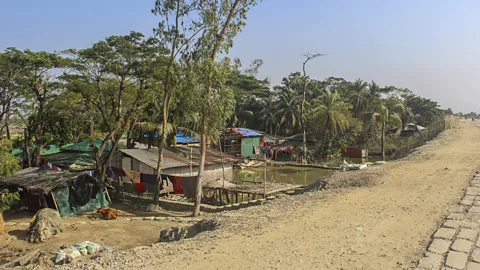 Sadiqur Rahman The homes of displaced people living along the Banshkhali embankment. By 2050, one in seven Bangladeshis will be displaced due to climate change (Credit: Sadiqur Rahman)