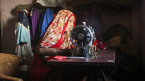 Sadiqur Rahman In 2021, Rahima Begum and her husband moved to a new, climate-resilient house with brick walls and a tin roof (Credit: Sadiqur Rahman)