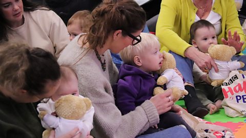 Grown ups and children at a Tiny Happy People session