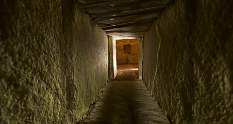 Historic Environment Scotland - HES Archives The long, low entrance passage to the tomb was designed to align with the setting of the midwinter sun (Credit: Historic Environment Scotland - HES Archives)