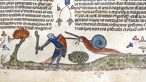 The British Library A medieval knight battles a snail in the margins of a text