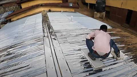 Meer Reflective roofs on slum dwellings are helping protect communities in Freetown, Sierra Leone, from extreme heat (Credit: Meer)