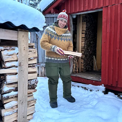 Riikka Morottaja Anna Morottaja has trouble drying the firewood she needs to heat her home due to higher humidity (Credit: Riikka Morottaja)