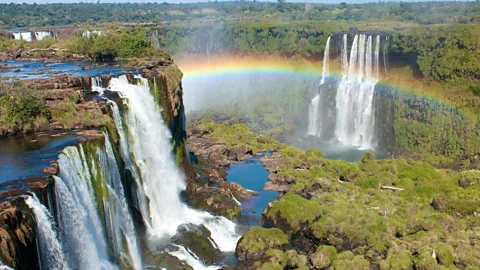 Getty Images Over 1.5 million tourists a year visit the UNESCO world heritage Iguazú or Iguaçu Falls, which form part of the border between Argentina and Brazil (Credit: Getty Images)