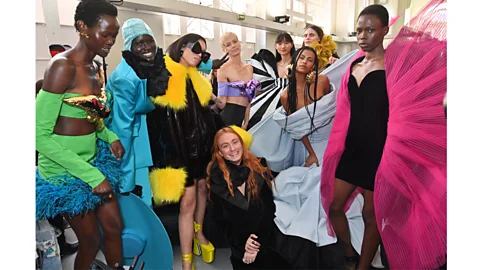 Getty Reed poses with models backstage at the Nina Ricci autumn/winter 2023-24 show in Paris – he was made creative director of the fashion house at the age of 26 (Credit: Getty)