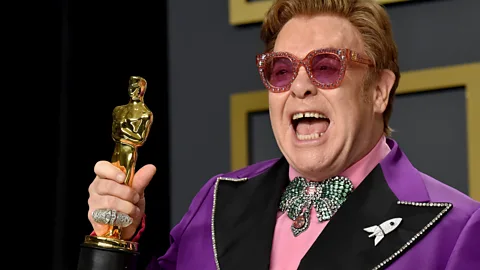 Getty Images Musician Elton John and lyricist Bernie Taupin, winners of the Original Song award for "(I'm Gonna) Love Me Again" from "Rocketman," pose in the press room during the 92nd Annual Academy Awards at Hollywood and Highland on February 09, 2020 in Hollywood