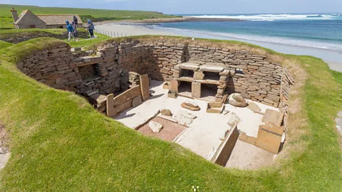 Alamy Skara Brae was first discovered in 1850, after a violent storm ripped away turf that had been covering it for millennia (Credit: Alamy)