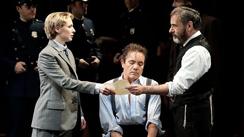 Three actors performing the court room scene of William Shakespeare's 'The Merchant of Venice'.